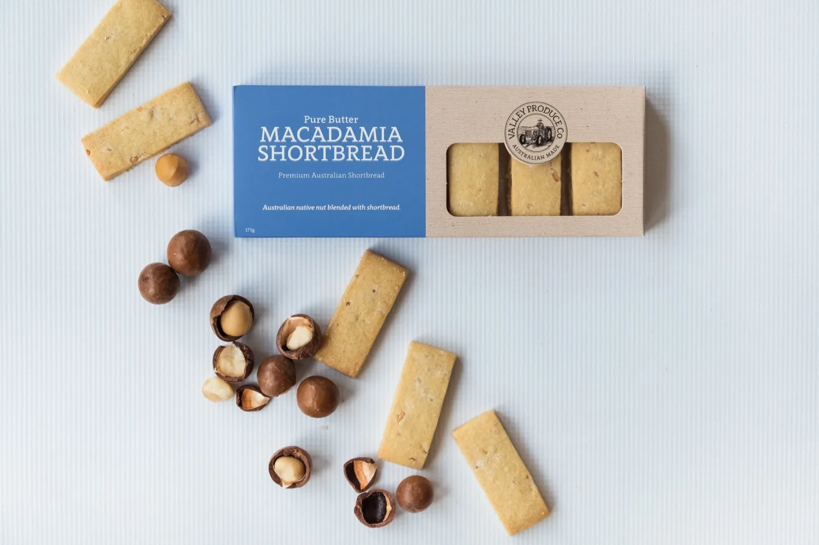 Valley Produce Co macadamia shortbread fingers and cracked macadamia nuts scattered beside