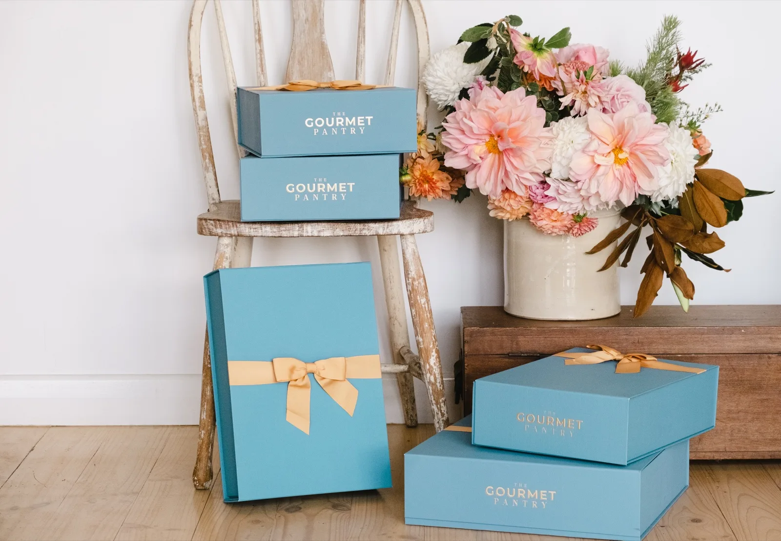 The Gourmet Pantry hampers in French Blue boxes across the size range, from the smallest to the largest