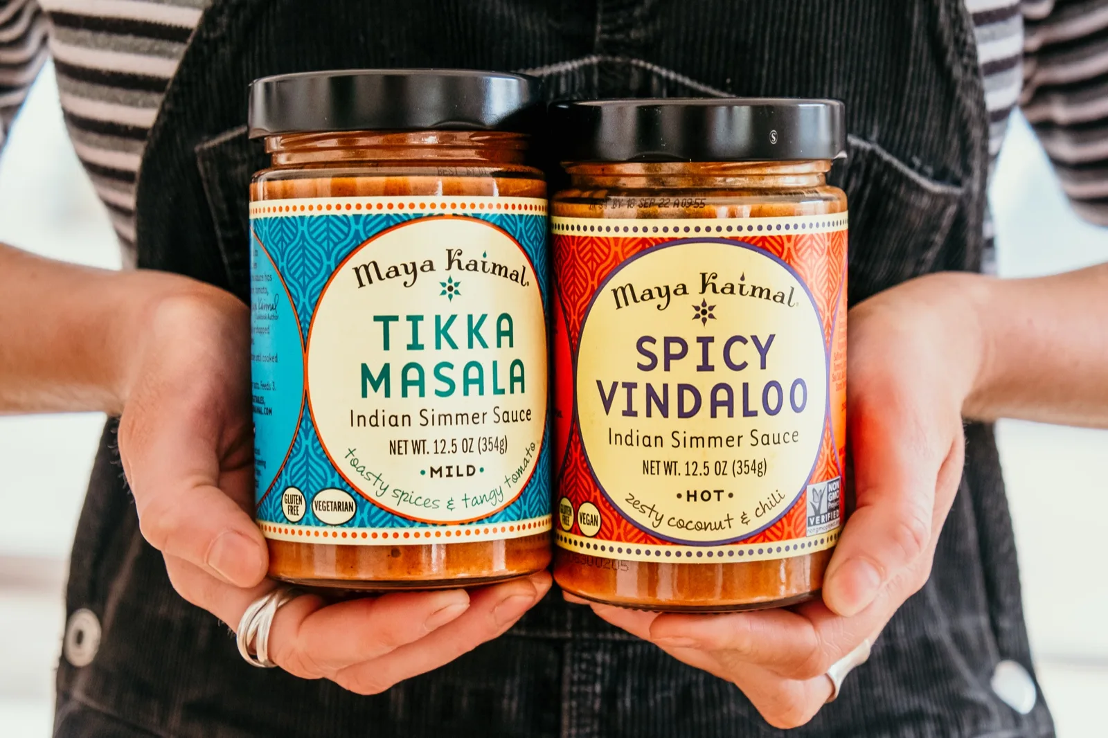 Maya Kaimal Spicy Vindaloo and Tikka Masala Indian simmer sauce jars held up side by side